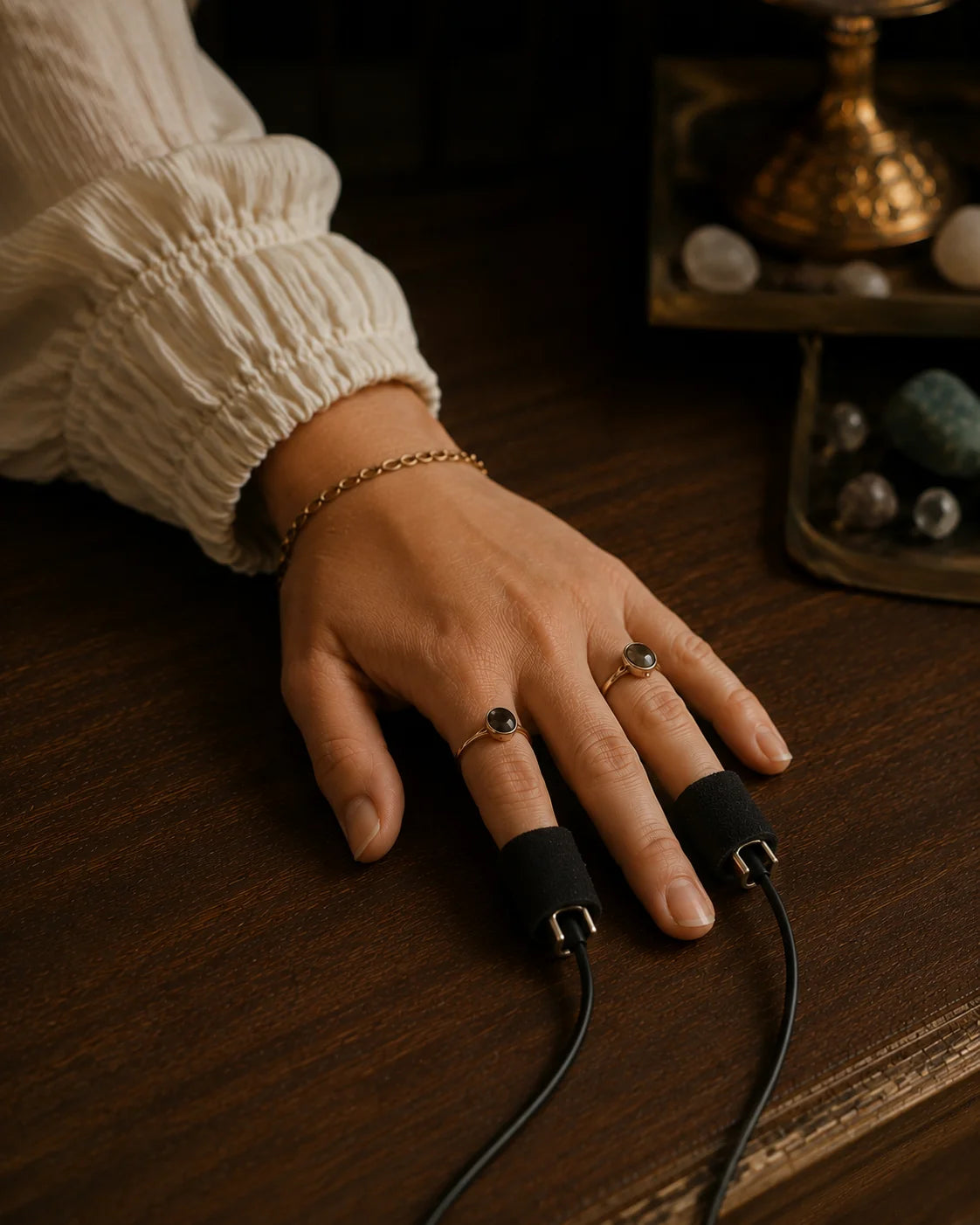 Illustrative hands resting on aura photography sensors